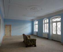 The large hall in the manor house is reconstructed with stucco in Art Nouveau style
